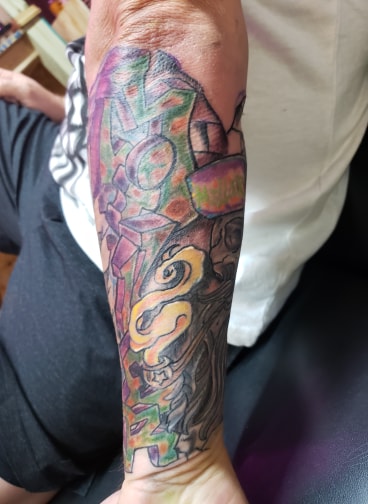 Explore cover up tattoo ideas for men, creative tattoo ideas in Dallas, available at Freak Show Studio