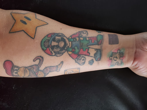 Find tattoo ideas for under the breast for your next unique tattoo in Grovetown at Art Collective Tattoos & Piercings