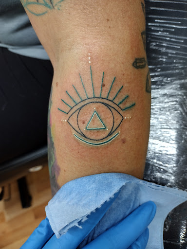 Explore traditional elbow tattoo ideas, creative tattoo ideas in Benton, available at Spectrum Tattoo