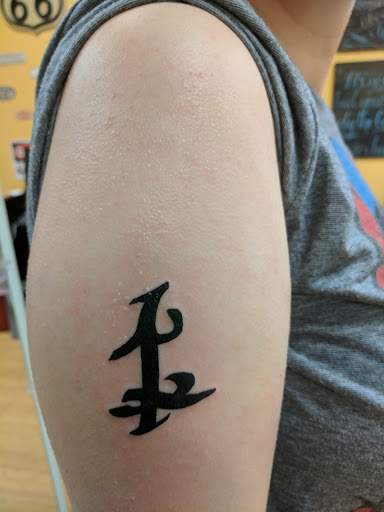 Explore flower spine tattoo ideas, creative tattoo ideas in Poughkeepsie, available at Queen City Tattoo