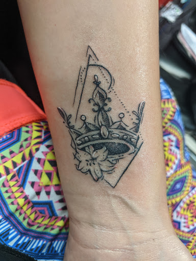 Explore women's hand tattoo ideas, creative tattoo ideas in Schaumburg, available at Atmosphere Tattoo Gallery - Schaumburg