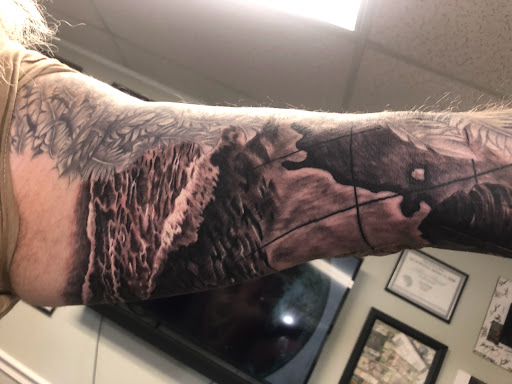 Explore tattoo ideas on back of neck, creative tattoo ideas in Englewood, available at Point of Entry Tattoo