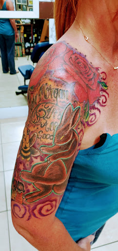 Explore mens western tattoo ideas, creative tattoo ideas in Englewood, available at The Original Big Daddy Tattoo & Body Piercing est.1997 est.1997