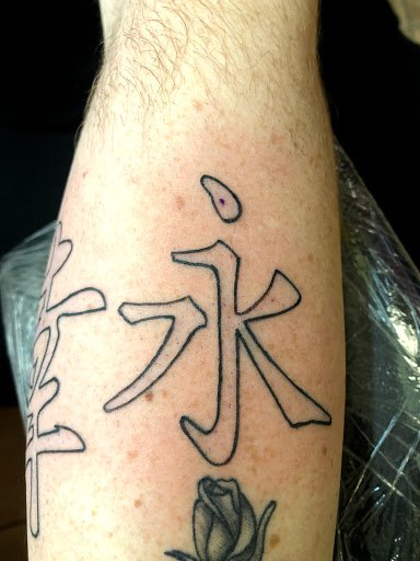 Find female rib tattoo ideas for your next unique tattoo in Okeechobee at Muck City Tattoos & Piercings