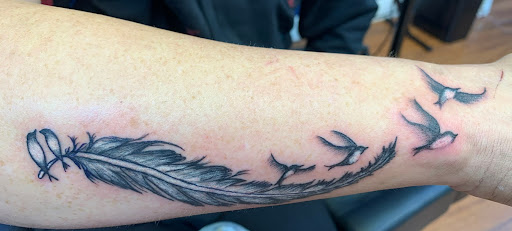 Explore tattoo ideas for men's back, creative tattoo ideas in Cocoa, available at Rorschach Tattoo Shop and Piercing Studio