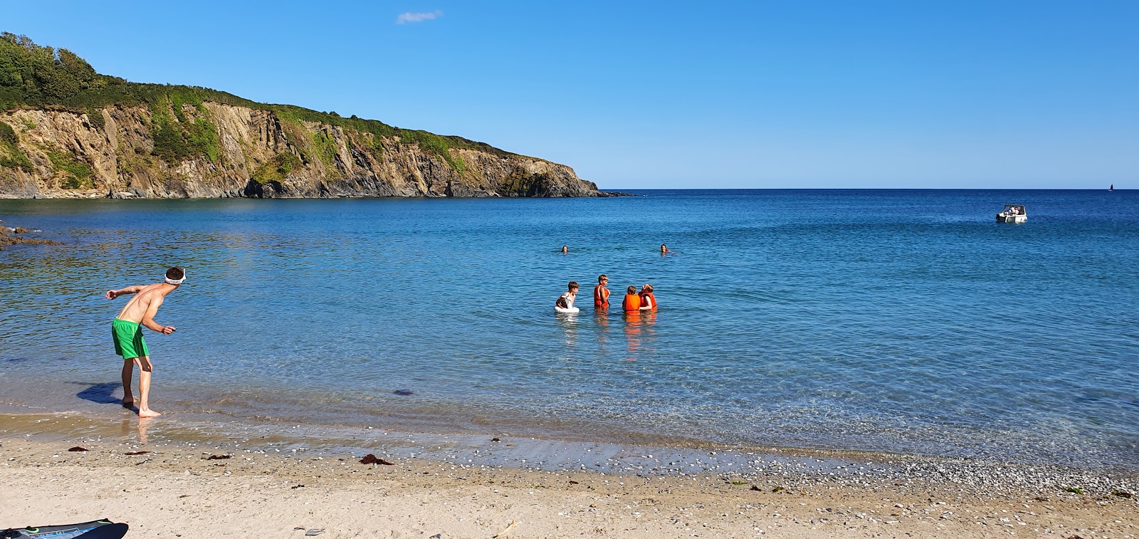 Photo of Polridmouth Cove with turquoise water surface