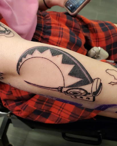 Explore jake the dog tattoo ideas, creative tattoo ideas in Palm Harbor, available at Angry Owl Tattoo and Piercing