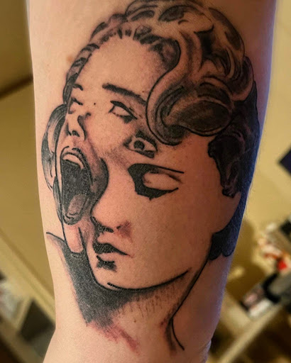 Explore tattoo ideas for hippies, creative tattoo ideas in Pikeville, available at The Carbon Canary Tattoo Studio