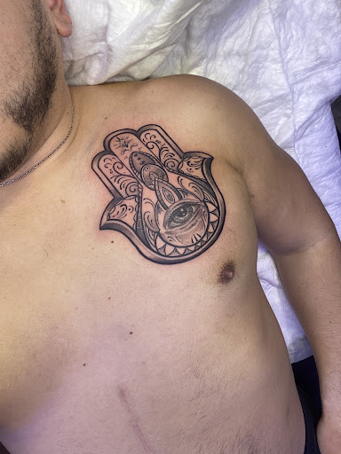 Explore religious elbow tattoo ideas, creative tattoo ideas in Dunellen, available at Staysharpink