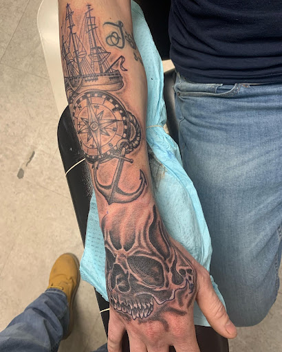 Explore flower arm tattoo ideas, creative tattoo ideas in Hudson Falls, available at ALTERED ADDICTION TATTOOS