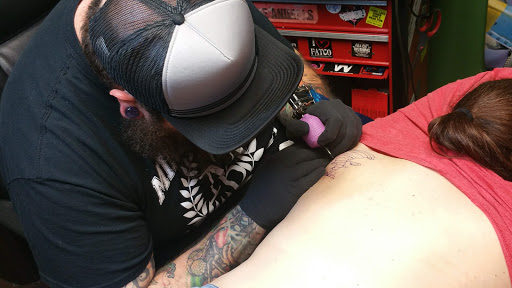 Explore dog tag tattoo ideas, creative tattoo ideas in Oklahoma City, available at Mind Bender Tattoo