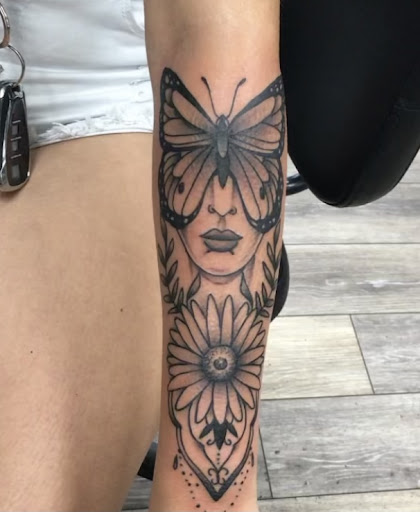 Explore cover up tattoo ideas female back, creative tattoo ideas in Bullhead City, available at Smoke and Dagger Tattoo