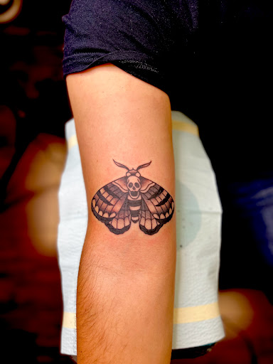 Explore small dinosaur tattoo ideas, creative tattoo ideas in Modesto, available at Inkwell Tattoo