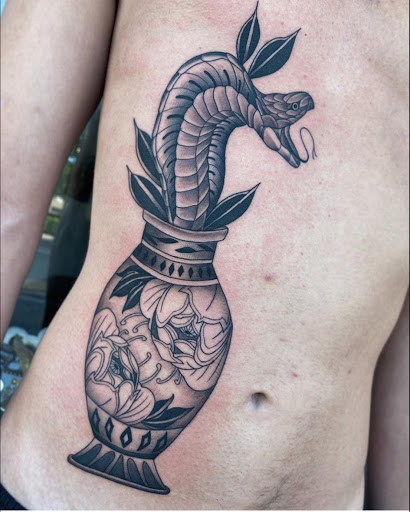 Explore hopeless romantic tattoo ideas, creative tattoo ideas in Hollywood, available at Sacred Eye Tattoos