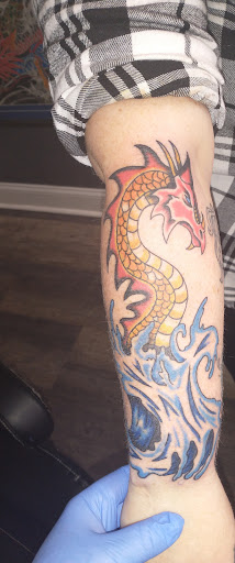 Explore wolf tattoo ideas for guys, creative tattoo ideas in Waynesboro, available at Tattooed In the Wild Studio