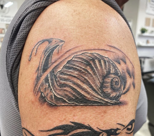 Find tattoo ideas armbands for your next unique tattoo in New Braunfels at SHARPTOOTH TATTOOS