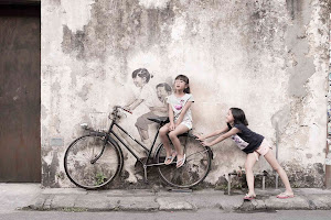 Mural - Kids on bicycle by Ernest Zacharevic image