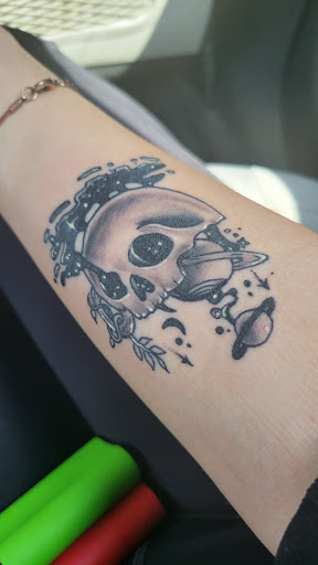 Explore inside ear tattoos ideas, creative tattoo ideas in Lawrence, available at Skin Illustrations Tattoos & Piercings