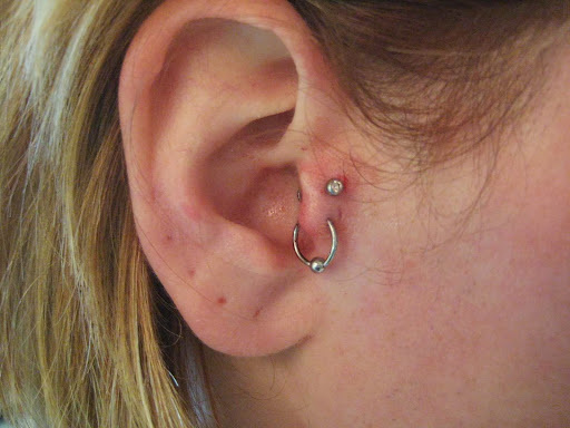 Explore above eyebrow tattoo ideas, creative tattoo ideas in Albany, available at Tom Spaulding Tattoo And Body Piercing Studio