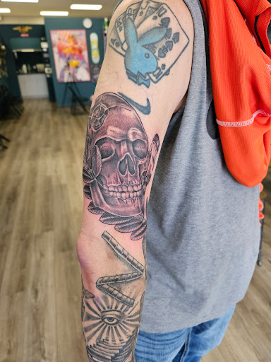 Explore men bicep tattoo ideas, creative tattoo ideas in Omaha, available at Grinn & Barrett Tattoo