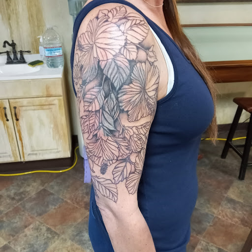 Explore grease tattoo ideas, creative tattoo ideas in Santa Cruz, available at Good Omen Tattoo