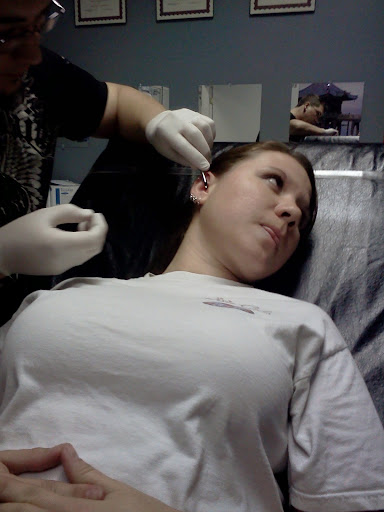 Explore candle tattoo ideas, creative tattoo ideas in Summerville, available at Exotic Impressions Body Piercing