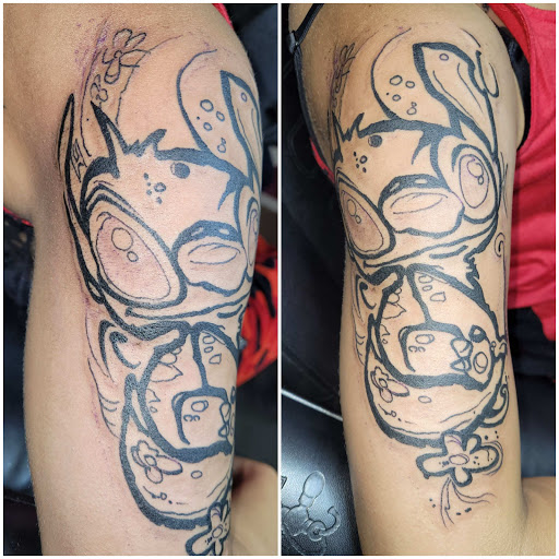 Explore tattoo ideas for upper back, creative tattoo ideas in Angola, available at Hoodlum Ink