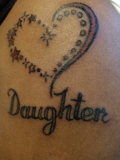 Explore tan tattoo ideas, creative tattoo ideas in Detroit, available at Swagg Shop (tattoos and piercings)