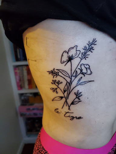 Explore black and white voodoo/ragdoll broken heart tattoo ideas, creative tattoo ideas in Reno, available at Evolution Tattoo