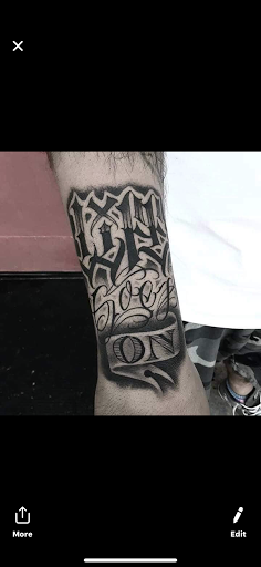 Explore leg tattoo ideas black male, creative tattoo ideas in Bakersfield, available at Bakersfield Tattoo & Piercing