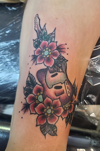 Explore tramp stamp lower back tattoo cover up ideas, creative tattoo ideas in Powell, available at AVALON COVE TATTOO