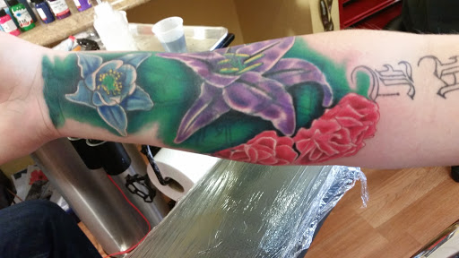 Explore ring tattoo cover up ideas, creative tattoo ideas in Cedar City, available at Macks Tattoo Shop