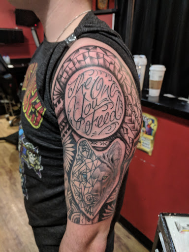 Explore middle of boob tattoo ideas, creative tattoo ideas in Winston Salem, available at Deja Vu