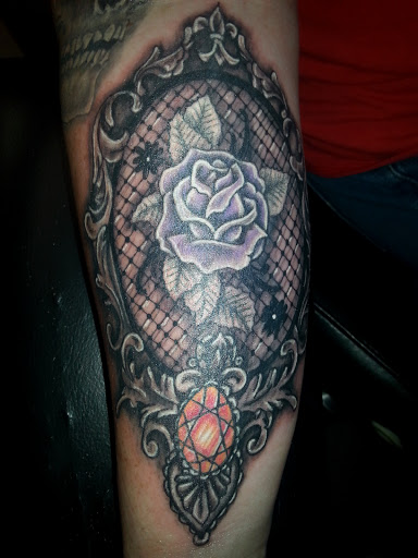 Explore carousel tattoo ideas, creative tattoo ideas in Anniston, available at Wicked Game Tattoo & Piercing Studio