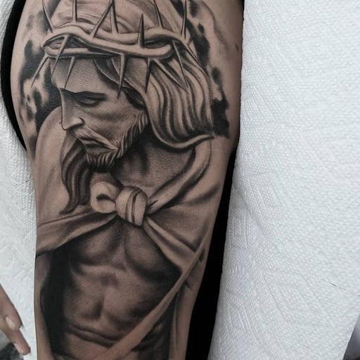 Explore cross sleeve tattoo ideas, creative tattoo ideas in Wichita Falls, available at Firme Copias Tattoo shop