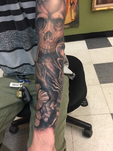 Explore girly half sleeve tattoo ideas for females, creative tattoo ideas in Garden Grove, available at Saints & Sinners Tattoo