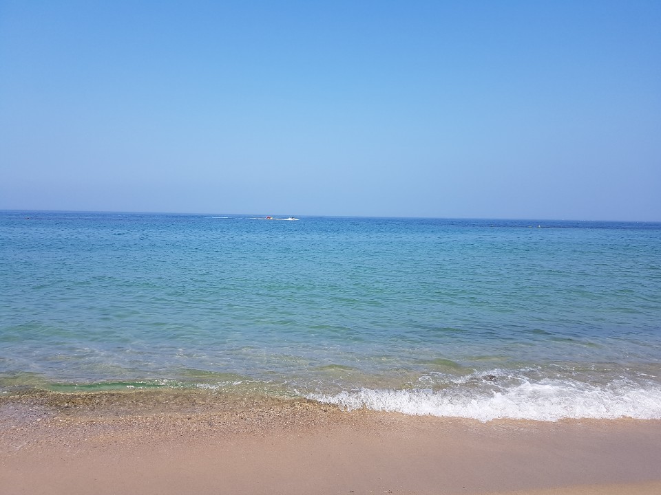 Photo of Tokcheon Beach backed by cliffs