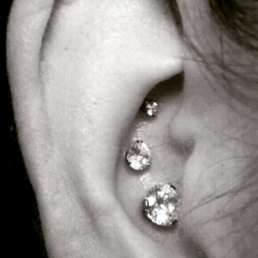 Explore front neck tattoo ideas, creative tattoo ideas in Albuquerque, available at Staceys Exotic Body Piercing and Tattoo