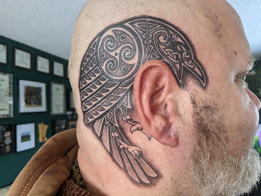 Explore above knee tattoo ideas, creative tattoo ideas in Rochester, available at Sacred Heart Studios