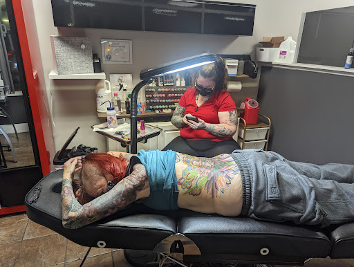 Explore female stomach tattoo ideas, creative tattoo ideas in Charlotte, available at Tattoo Bills Charlotte