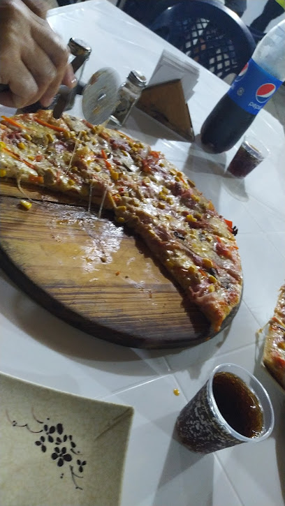 pizzeria el Encanto - GQ99+V87, Unnamed Rd,Araure, Araure, Portuguesa, Venezuela