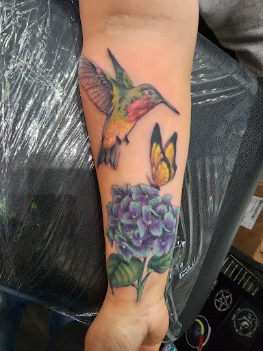Explore january birth flower tattoo ideas, creative tattoo ideas in Bay City, available at Electric Chair Tattoo