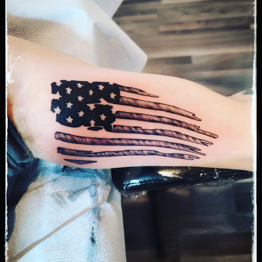 Explore name tattoo ideas on neck, creative tattoo ideas in Clarkston, available at Rogue Tattoo