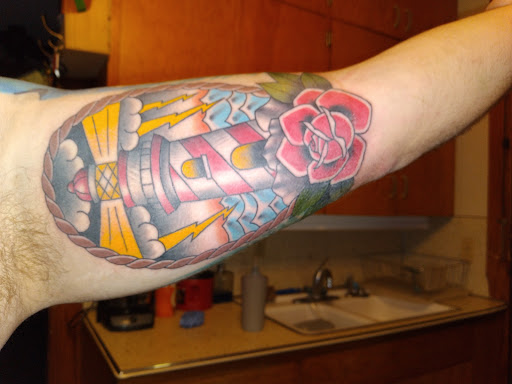 Find tattoo ideas angels for your next unique tattoo in Dubuque at The Crows Nest