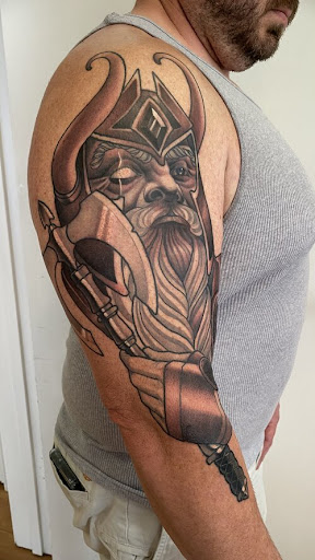 Explore cool sleeve tattoo ideas for guys, creative tattoo ideas in New Orleans, available at TOUGH LOVE TATTOOS