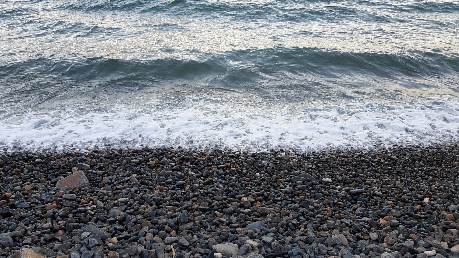 Foto af Hau Beach med turkis rent vand overflade