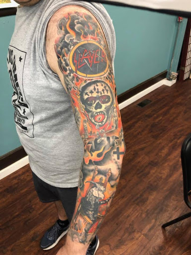 Explore men's arm sleeve tattoo ideas, creative tattoo ideas in Houghton Lake, available at Screaming Eagle Tattoo