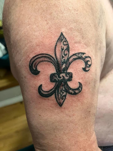Explore tattoos ideas for men cross, creative tattoo ideas in Lake City, available at Crooked Spines Tattoo Studio