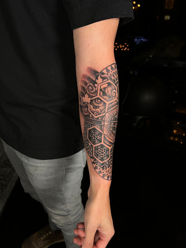 Explore joker hand tattoo ideas, creative tattoo ideas in Spokane, available at Moon and Mercury Tattoo