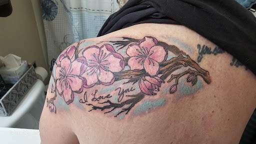 Explore womens sleeve tattoo ideas, creative tattoo ideas in Omaha, available at Ironwood Ink